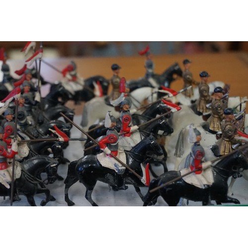 869 - Britains: fourteen vintage lead Britains mounted Life Guards and Horse Guards; together with four mo... 