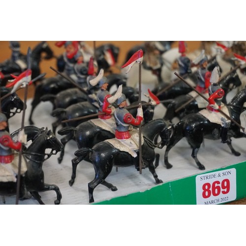 869 - Britains: fourteen vintage lead Britains mounted Life Guards and Horse Guards; together with four mo... 