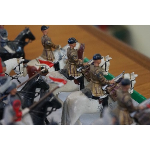 869 - Britains: fourteen vintage lead Britains mounted Life Guards and Horse Guards; together with four mo... 