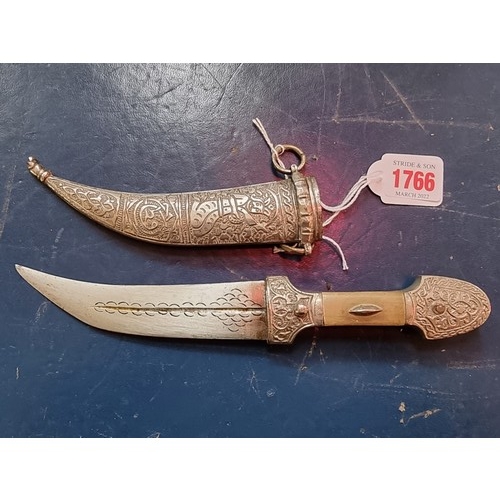 1766 - Two large kukris and sheaths; together with a Indo-Persian jambiya and metal sheath.... 