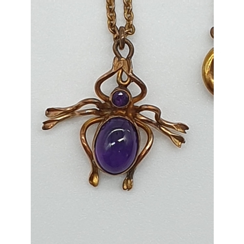 61 - (NB) A late Victorian yellow metal spider pendant, with cabochon amethyst body and facetted amethyst... 