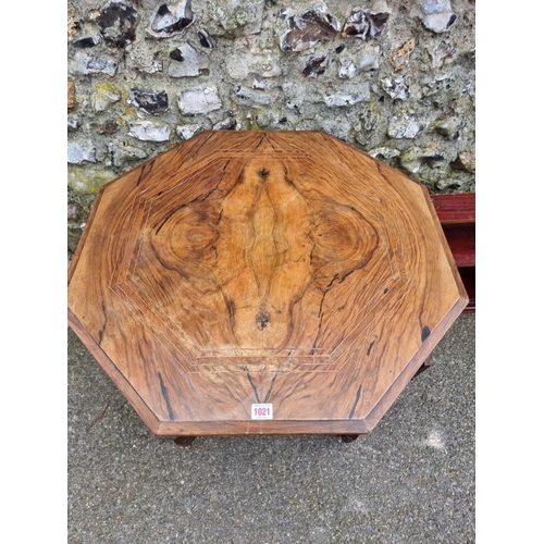 1021 - A late Victorian walnut hexagonal table, 66.5cm high x 74xm wide; together with a hanging cupboard.... 