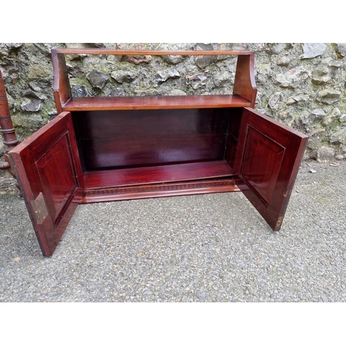 1021 - A late Victorian walnut hexagonal table, 66.5cm high x 74xm wide; together with a hanging cupboard.... 