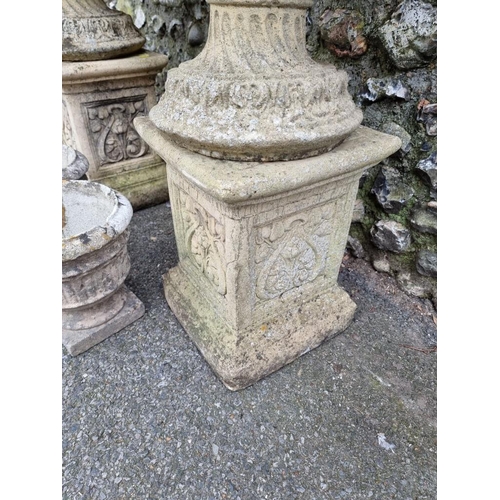 1022 - A pair of reconstituted stone bird baths; together with two similar smaller urns. ... 