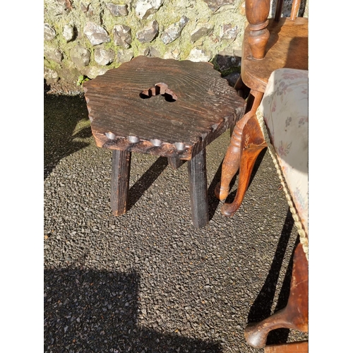 1060 - An old oak Windsor style chair; together with three old stools. 