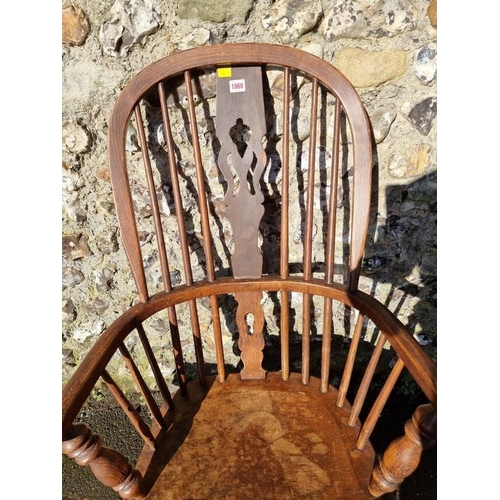 1060 - An old oak Windsor style chair; together with three old stools. 