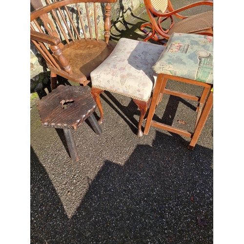 1060 - An old oak Windsor style chair; together with three old stools. 