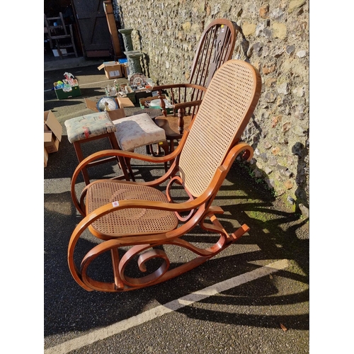 1061 - A bentwood and cane rocking chair. 