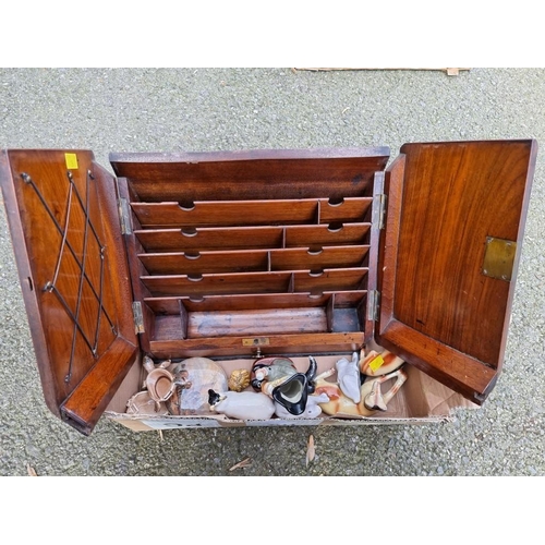 1070a - An antique walnut stationary cabinet, together with sundry ceramics.