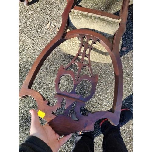 1071 - A set of four mahogany shield back dining chairs. 