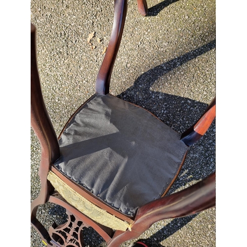 1071 - A set of four mahogany shield back dining chairs. 