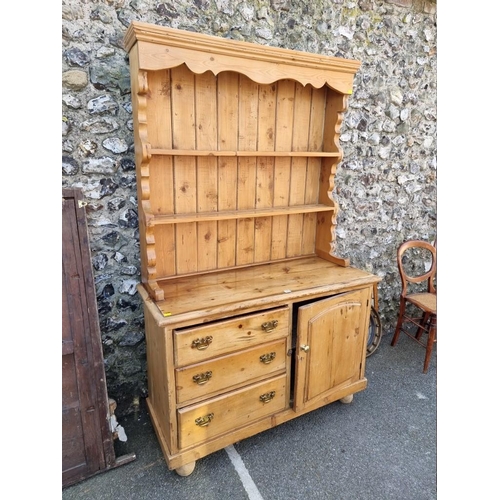 1093 - An old pine dresser and rack, 120cm wide x 194cm high.