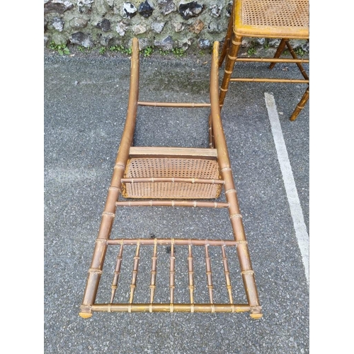 1097 - A pair of faux bamboo cane seated chairs. 