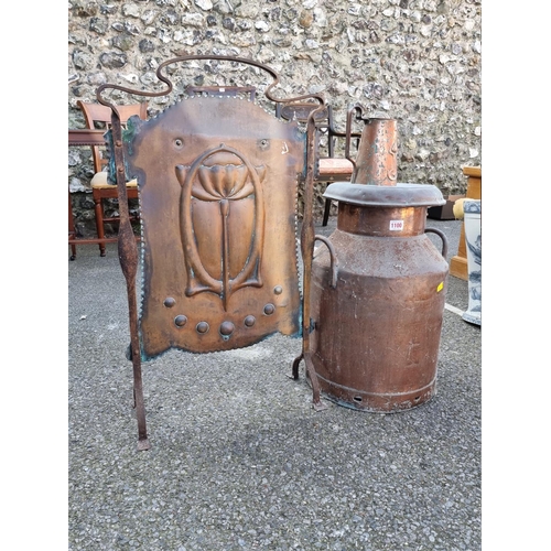 1100 - An Art Nouveau copper firescreen; together with a similar jug; and a large copper milk churn. (3)... 