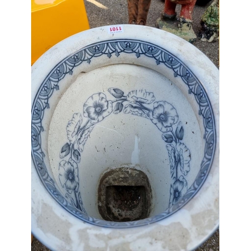 1101 - An old blue and white pottery toilet. 