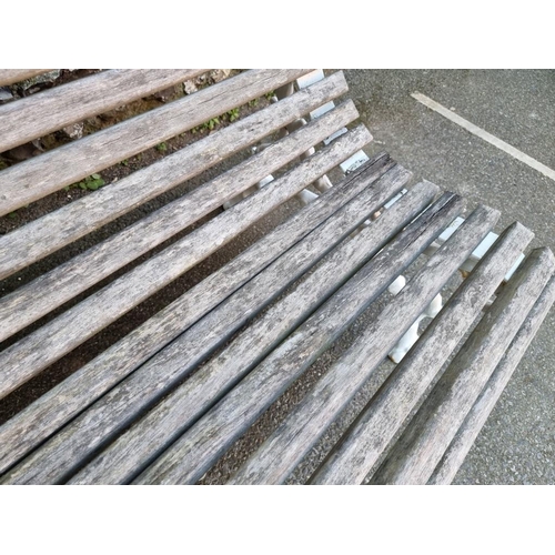 1114 - A Victorian cast iron bench, having wooden slats, 130cm wide.