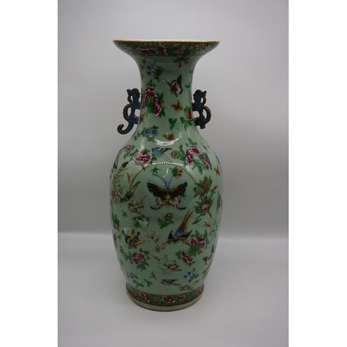 1773 - A large pair of Chinese famille rose celadon ground twin handled vases, decorated with pheasants and... 