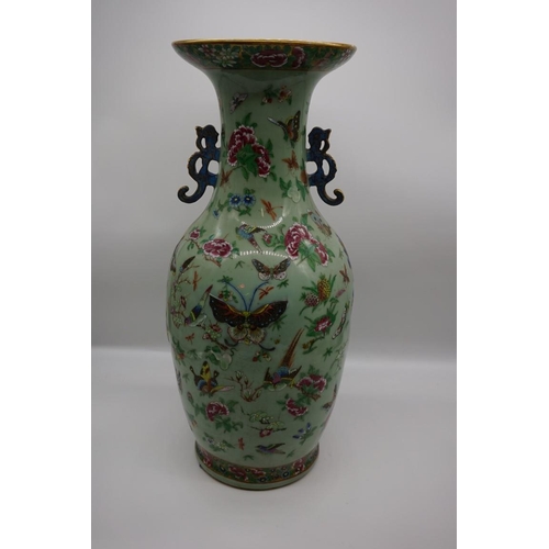 1773 - A large pair of Chinese famille rose celadon ground twin handled vases, decorated with pheasants and... 