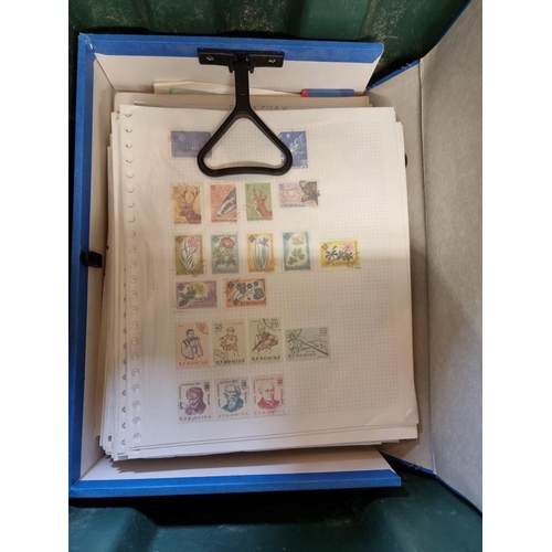 64 - STAMPS: a quantity of modern stamps in 2 file boxes, plus an album of presentation packs postal... 