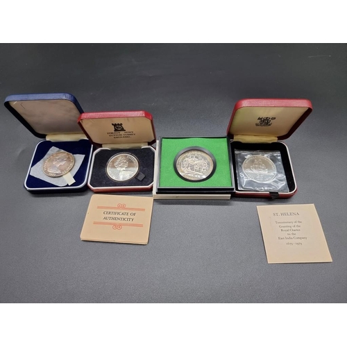 855 - Coins: a cased Royal Mint silver proof St Helena 1973 tercentenary crown; together with three other ... 