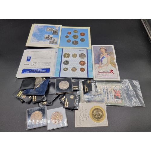 857 - Coins: a collection of commemorative coin sets in presentation packs; and others to include crowns.... 