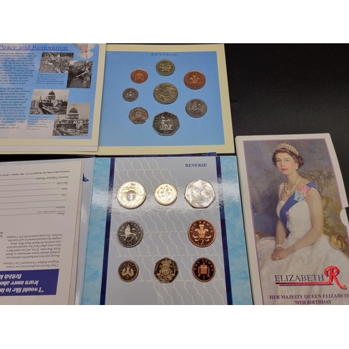 857 - Coins: a collection of commemorative coin sets in presentation packs; and others to include crowns.... 