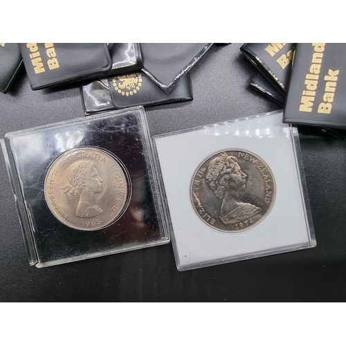 857 - Coins: a collection of commemorative coin sets in presentation packs; and others to include crowns.... 