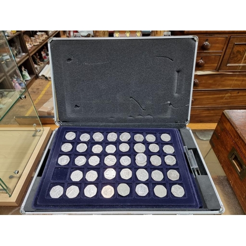 864 - Coins: a case of coins, to include: collectable fifty pence pieces; and two pound coins.... 