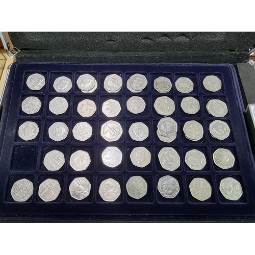 864 - Coins: a case of coins, to include: collectable fifty pence pieces; and two pound coins.... 