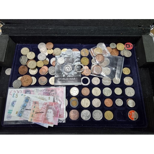 864 - Coins: a case of coins, to include: collectable fifty pence pieces; and two pound coins.... 