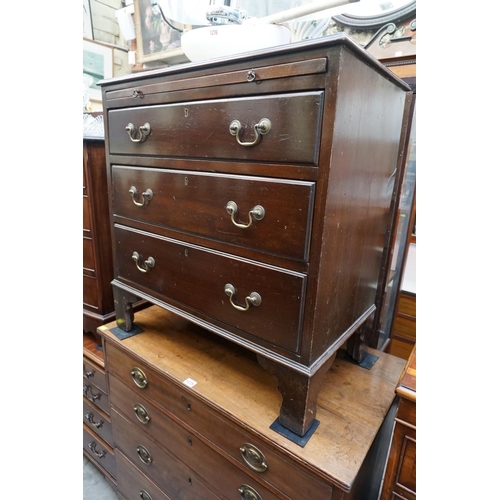 1214 - An early 20th century mahogany three drawer chest, with brushing slide, 73cm wide.