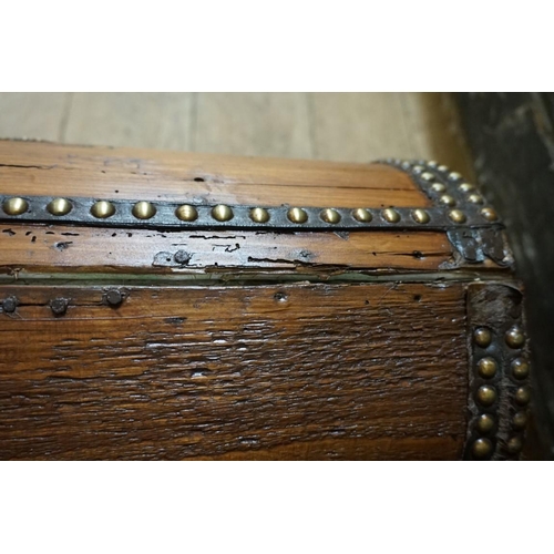 1342 - An antique bass studded dome top casket, 53cm wide.