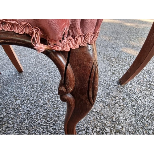 1023 - A set of six Victorian carved rosewood dining chairs. 