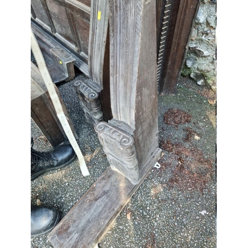 1034 - An antique oak canopy, carved 'A Warm Welcome', 258cm wide; together with various oak supports,... 