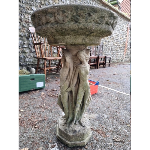 1045 - A reconstituted stone figural birdbath, 77.5cm high. 