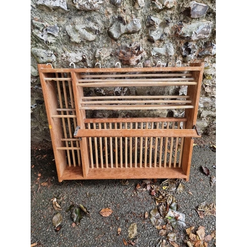 1062 - A pine hanging plate rack, 71cm wide. 