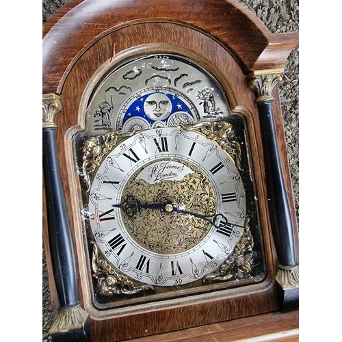 1100 - A reproduction 'St James London' wall clock; together with one other wall clock. ... 