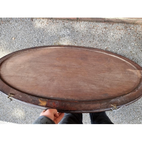 1117 - A mahogany oval wall mirror; together with one other mirror.