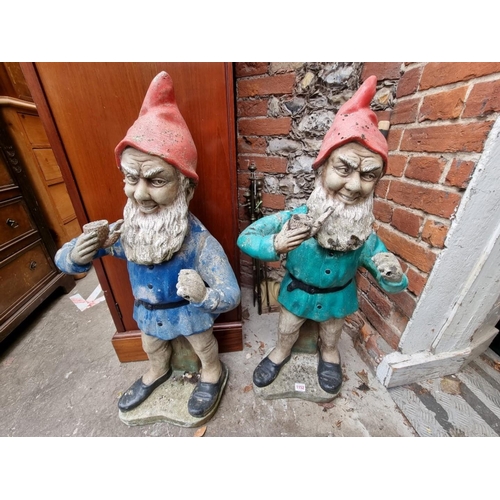 1152 - Two large polychrome painted gnomes, 88cm high.