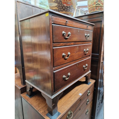 1214 - An early 20th century mahogany three drawer chest, with brushing slide, 73cm wide.