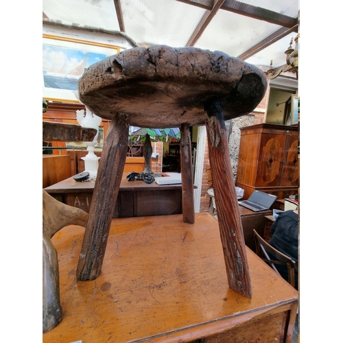 1221 - An old pine cricket table, 50cm diameter.