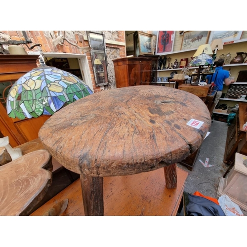 1221 - An old pine cricket table, 50cm diameter.