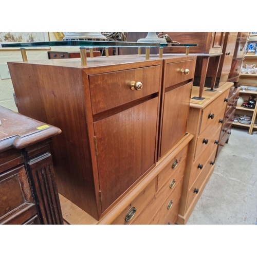 1227 - A pair of walnut bedside tables, each with glass top, 43cm wide. 