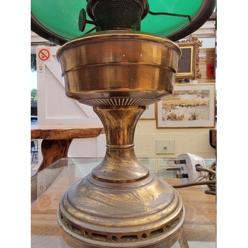 1229 - A brass and green glass table lamp, (electrified), height excluding chimney 41cm. ... 