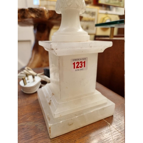 1231 - An alabaster table lamp, height excluding fitting 55cm.