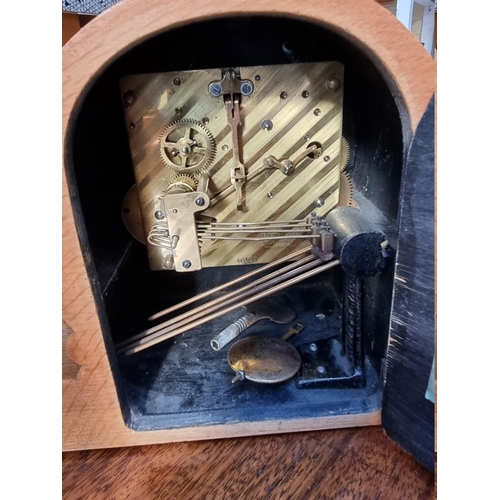 1238 - A 1930s pale oak mantel clock, chiming on four straight gongs, 35.5cm wide.