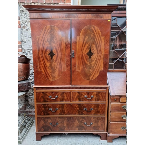 1244 - An early 20th century mahogany and inlaid linen press, 129cm wide.  