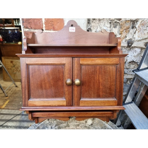 1246 - An early 20th century walnut wall cabinet, 46cm wide.