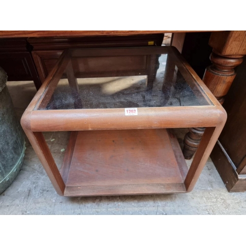 1262 - A vintage walnut and glass inset two tier occasional table, 53.5cm wide. 