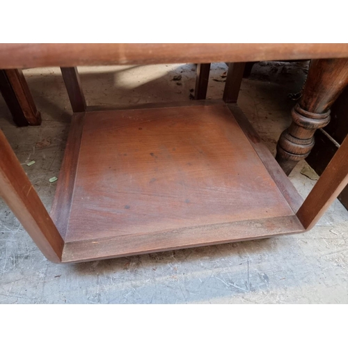 1262 - A vintage walnut and glass inset two tier occasional table, 53.5cm wide. 